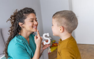 Shot of a speech therapist during a session with a little boy